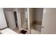 Bright bathroom featuring a soaking tub and glass enclosed shower at 5719 Singlebriar Ct, Norcross, GA 30093