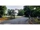 Entrance view of the gated community, showcasing the entrance and landscaping at 5719 Singlebriar Ct, Norcross, GA 30093