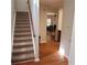 View of carpeted stairs and wood flooring in home's entry way at 5719 Singlebriar Ct, Norcross, GA 30093