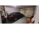 Two car garage with black SUV parked inside at 5719 Singlebriar Ct, Norcross, GA 30093