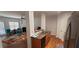 View of kitchen, eat in area, and living room with granite countertops and stainless appliances at 5719 Singlebriar Ct, Norcross, GA 30093