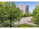 Balcony view featuring a vibrant cityscape surrounded by lush greenery at 700 Park Regency Ne Pl # 703, Atlanta, GA 30326