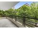 Open balcony showcasing a vibrant cityscape and lush greenery at 700 Park Regency Ne Pl # 703, Atlanta, GA 30326