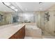 Luxurious bathroom with a soaking tub, a glass-enclosed shower, and dual sinks at 700 Park Regency Ne Pl # 703, Atlanta, GA 30326