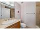 Bathroom features a tile shower, granite vanity and neutral paint color at 700 Park Regency Ne Pl # 703, Atlanta, GA 30326