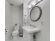 Bathroom with white marble floors, toilet and ornate sink at 700 Park Regency Ne Pl # 703, Atlanta, GA 30326
