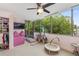 bedroom with pink accent wall, ceiling fan, carpet floors and large window view at 700 Park Regency Ne Pl # 703, Atlanta, GA 30326