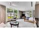 Bright bedroom with large windows, comfortable seating, and stylish decor at 700 Park Regency Ne Pl # 703, Atlanta, GA 30326