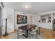 Inviting dining area with modern chandelier and an adjacent kitchen and view at 700 Park Regency Ne Pl # 703, Atlanta, GA 30326