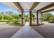 Elegant entryway with manicured landscaping, circular drive, and covered portico creating an inviting arrival experience at 700 Park Regency Ne Pl # 703, Atlanta, GA 30326