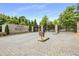 Grand entrance to Park Regency with stone pillars, iron gates, and well-maintained landscaping at 700 Park Regency Ne Pl # 703, Atlanta, GA 30326