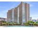 Upscale condominium building with an outdoor pool and lounge area at 700 Park Regency Ne Pl # 703, Atlanta, GA 30326