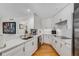 Contemporary kitchen with white cabinetry, quartz countertops and stainless steel appliances at 700 Park Regency Ne Pl # 703, Atlanta, GA 30326
