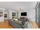 Bright living room featuring an entertainment center and a view to the kitchen at 700 Park Regency Ne Pl # 703, Atlanta, GA 30326