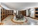 Luxurious wine room featuring stone floors, custom cabinets, and a central tasting table for an elegant experience at 700 Park Regency Ne Pl # 703, Atlanta, GA 30326