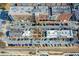 Aerial view of a mixed use development featuring retail space, restaurants, parking and residences at 164 Inwood Walk, Woodstock, GA 30188