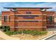 The brick front entrance of the Northside Hospital Cherokee Amphitheater has visible signage at 164 Inwood Walk, Woodstock, GA 30188
