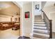 View of the finished basement and staircase, showcasing the additional living space in this home at 164 Inwood Walk, Woodstock, GA 30188