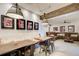 Finished basement with a dining table, seating area, and stylish industrial lighting at 164 Inwood Walk, Woodstock, GA 30188