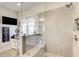 The shower features beautiful tile, and a glass enclosure to allow light into the room at 164 Inwood Walk, Woodstock, GA 30188