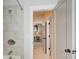 Bathroom shower area with gray subway tiles and view to the next room at 164 Inwood Walk, Woodstock, GA 30188