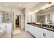 The bathroom offers double vanities with a granite top, and a tiled glass enclosed shower at 164 Inwood Walk, Woodstock, GA 30188