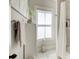 Bright bathroom area with shower and towel rack and decorative items at 164 Inwood Walk, Woodstock, GA 30188