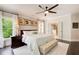 The primary bedroom features large windows for natural light and a view to the attached bath at 164 Inwood Walk, Woodstock, GA 30188