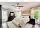 Spacious bedroom with hardwood floors and lots of natural light from the large windows at 164 Inwood Walk, Woodstock, GA 30188