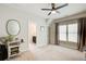 Bedroom featuring large windows with shades and a bathroom view at 164 Inwood Walk, Woodstock, GA 30188