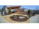 Inviting outdoor patio area with comfortable seating, perfect for relaxation and socializing in the community at 164 Inwood Walk, Woodstock, GA 30188