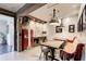 Charming dining area with brick wall, rustic wood accents, and unique vintage-style refrigerator at 164 Inwood Walk, Woodstock, GA 30188