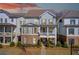 Charming two-story home with a covered front porch, appealing design, and landscaped front yard at 164 Inwood Walk, Woodstock, GA 30188