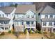 Charming two-story home with brick accents and a cozy front porch, nestled in a well-manicured neighborhood at 164 Inwood Walk, Woodstock, GA 30188