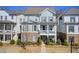 Charming two-story home with brick accents and a cozy front porch, nestled in a well-manicured neighborhood at 164 Inwood Walk, Woodstock, GA 30188