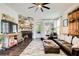 Comfortable living area with a fireplace, leather seating, and rustic decor at 164 Inwood Walk, Woodstock, GA 30188