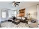 Bright living room with hardwood floors, natural light, and rustic decor at 164 Inwood Walk, Woodstock, GA 30188