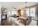Cozy living and dining area featuring rustic accents, ample seating, and hardwood floors throughout at 164 Inwood Walk, Woodstock, GA 30188