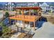 Elevated community lounge area featuring comfortable outdoor seating, wooden deck and a lower level storage area at 164 Inwood Walk, Woodstock, GA 30188