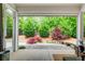 Relaxing patio with a view of the private, landscaped backyard at 164 Inwood Walk, Woodstock, GA 30188