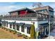 Exterior view of Rootstock Restaurant featuring a modern design, outdoor patio, and street-side appeal at 164 Inwood Walk, Woodstock, GA 30188