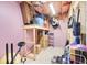 Unfinished storage space in the basement with exposed insulation and ample shelving at 164 Inwood Walk, Woodstock, GA 30188