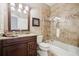 Well-lit bathroom with a shower and tub combination and a granite vanity at 1800 Hunters Moon Dr, Alpharetta, GA 30005