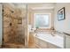 Bathroom featuring a tiled shower and separate soaking tub at 1800 Hunters Moon Dr, Alpharetta, GA 30005