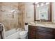 Bathroom featuring a shower and tub combination and granite vanity at 1800 Hunters Moon Dr, Alpharetta, GA 30005