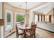 Charming breakfast nook with views of the backyard pool and access to the living area at 1800 Hunters Moon Dr, Alpharetta, GA 30005