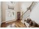 Bright, spacious foyer with hardwood floors, staircase, and decorative glass double doors at 1800 Hunters Moon Dr, Alpharetta, GA 30005