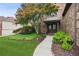 Inviting entrance with well-maintained landscaping and a walkway leading to the front door at 1800 Hunters Moon Dr, Alpharetta, GA 30005