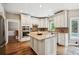 Bright kitchen with an island, stainless steel appliances, and light wood flooring at 1800 Hunters Moon Dr, Alpharetta, GA 30005