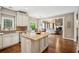 Bright, open kitchen with white cabinetry, granite countertops, and a spacious center island at 1800 Hunters Moon Dr, Alpharetta, GA 30005